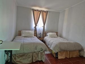 Postel nebo postele na pokoji v ubytování Hostal Los Almendros
