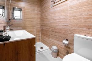 a bathroom with a sink and a toilet at Panoramic River View Downtown With Terrace in Porto +29 photos