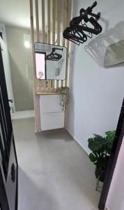 a hallway with a stove in a room at Estudio Pequeño in Conil de la Frontera