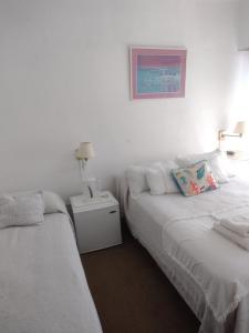 Una cama o camas en una habitación de Hotel Barracuda