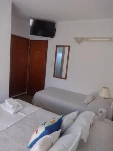 Una cama o camas en una habitación de Hotel Barracuda