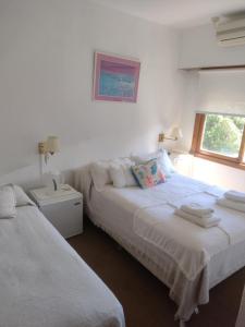 Una cama o camas en una habitación de Hotel Barracuda