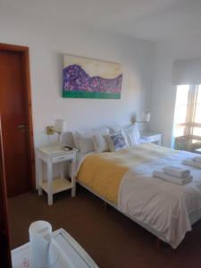 Una cama o camas en una habitación de Hotel Barracuda