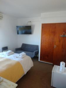 Una cama o camas en una habitación de Hotel Barracuda
