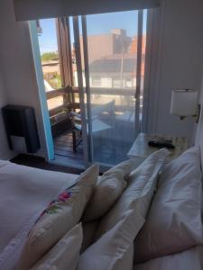 Una cama o camas en una habitación de Hotel Barracuda