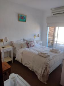 Una cama o camas en una habitación de Hotel Barracuda