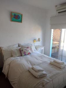 Una cama o camas en una habitación de Hotel Barracuda