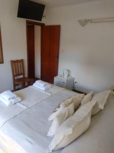 Una cama o camas en una habitación de Hotel Barracuda