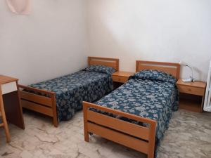 Ένα ή περισσότερα κρεβάτια σε δωμάτιο στο struttura in villa molto confortevole +51 φωτογραφίες