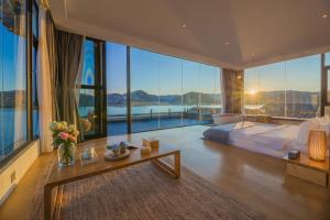Dali Muhai Island Designer Seaview Manor 객실 침대