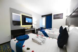Ένα ή περισσότερα κρεβάτια σε δωμάτιο στο Grand Plaza Al Madina +42 φωτογραφίες