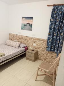 Posteľ alebo postele v izbe v ubytovaní Alojamientos Playa Centro Corralejo a