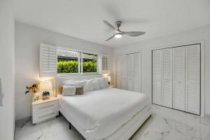 a white bedroom with a bed and a window at MIAMI Art Villa Heated Saltwater Pool with SPA EV in Dania Beach +55 photos