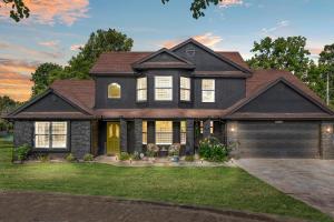 a home with a black house at Turkey Mountian Trailside By Tulsa Getaways in Tulsa