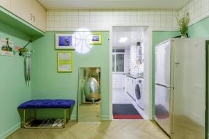 a laundry room with a washer and dryer at Chengdu city center Tianfu Square Kuanzhai Alley People's Park subway post-modern design 85 square meters 2 bedrooms 1 living room design B&B HD cinema family suite in Chengdu