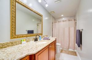 a bathroom with a sink and a mirror at Less Than 1 Mi to Restaurants and CCF Ocala Home with Yard! in Ocala +21 photos