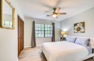 a bedroom with a bed and a ceiling fan at Less Than 1 Mi to Restaurants and CCF Ocala Home with Yard! in Ocala