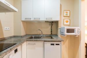 Η κουζίνα ή μικρή κουζίνα στο Veoapartment Alhóndiga Bajo
