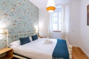 Ένα ή περισσότερα κρεβάτια σε δωμάτιο στο Veoapartment Alhóndiga Bajo