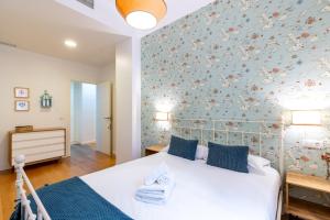 Ένα ή περισσότερα κρεβάτια σε δωμάτιο στο Veoapartment Alhóndiga Bajo