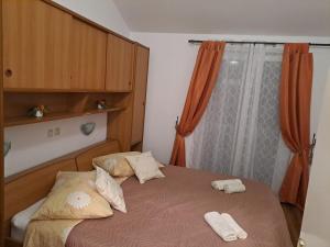Postel nebo postele na pokoji v ubytování Apartments Mig