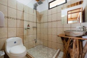 a bathroom with a toilet and a sink at Alas House, Monteverde with amazing sunset view! in Monteverde Costa Rica +38 photos