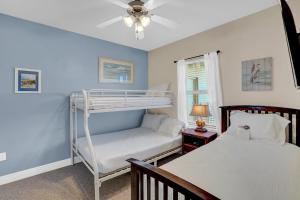 a bedroom with two bunk beds and a window at Crystal Tower 508 by Vacation Homes Collection in Gulf Shores