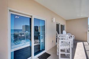 a balcony with a chair and a view of the ocean at Crystal Tower 508 by Vacation Homes Collection in Gulf Shores +44 photos