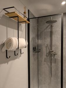a shower with a towel rack and a glass shower stall at Ty Hiraeth in Caerphilly +18 photos