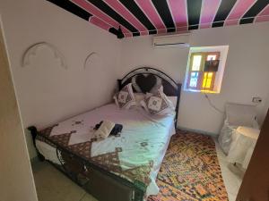 Postel nebo postele na pokoji v ubytování Riad Dar Lemdrssa