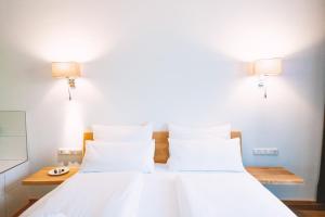 Ліжко або ліжка в номері Aktivhotel Wildschütz