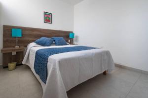 Giường trong phòng chung tại R4 Oaxaca Experience