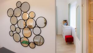 a room with a bunch of mirrors on the wall at Homey Luxury- entire house, free parking, yard in Cluj-Napoca