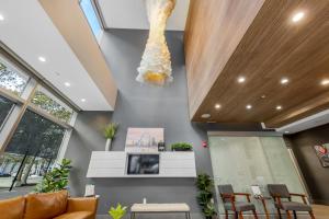 a living room with a sculpture of a shell hanging from the ceiling at Towers At Opop 604 Spacios And Cozy 2 Bd 1 B in Saint Louis