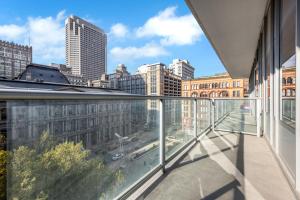 an apartment balcony with a view of a city at Towers At Opop 703 Spacios And Cozy 1 Bd 1 B in Saint Louis