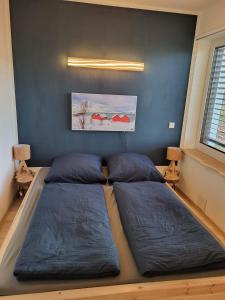 Postel nebo postele na pokoji v ubytování Modern-gemütliche FeWo mit Sauna