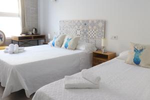 Hotel CALPE客房内的一张或多张床位
