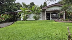 a lawn in front of a house at Arboledas house by the River,Forest and Gardens in San Francisco