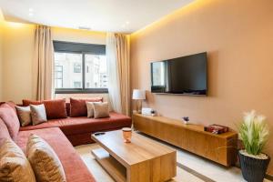 Et tv og/eller underholdning på Coral Coastal Suite - Beach & Pool