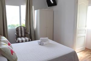 Łóżko lub łóżka w pokoju w obiekcie Hotel Casa Día y Noche