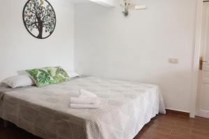 Łóżko lub łóżka w pokoju w obiekcie Hotel Casa Día y Noche