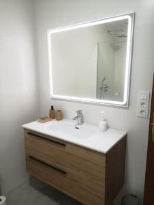 a bathroom with a sink and a mirror at Casa Parador De Santa María in Villarrobledo +17 photos