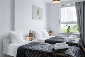 Giường trong phòng chung tại Urban Chic - Premium City-Center Stay on Pereca Street