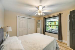 a bedroom with a bed and a ceiling fan at 4 Mi to Beach Pet-Friendly Home in Naples! in Naples +24 photos