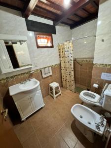 a bathroom with a sink and a toilet at Okin5 in Costa del Este