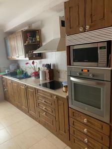 Kuchyň nebo kuchyňský kout v ubytování ArYa