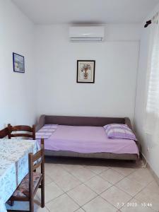 Postel nebo postele na pokoji v ubytování Apartment Slaven