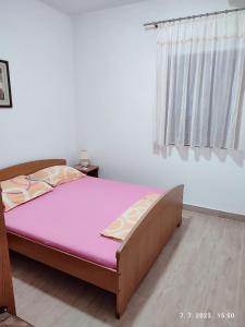 Postel nebo postele na pokoji v ubytování Apartment Slaven