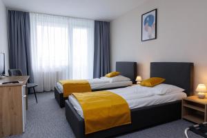 Rúm í herbergi á Hotel FIT