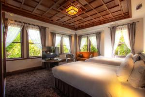 Postel nebo postele na pokoji v ubytování Hotel Utano Kyoto Besho
